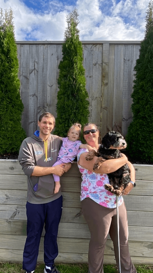 Karl and Brooke, PupManager's founders, with their daughter and dog